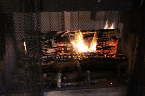 Burning fire in fireplace.