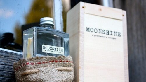 A successful business launches with a bottle of moosehead gin sitting on a window sill.