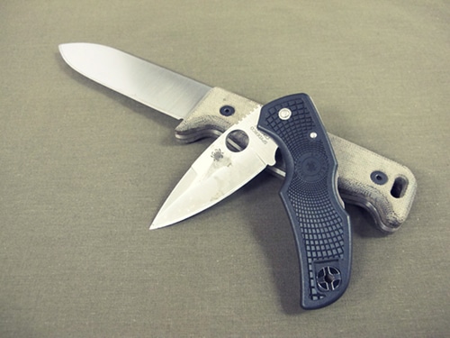 Survival knives fixed blade and folding blade.
