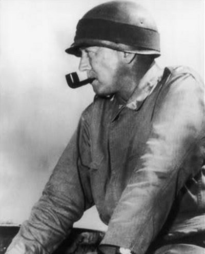 Vintage George Patton wearing army helmet with smoking pipe. 