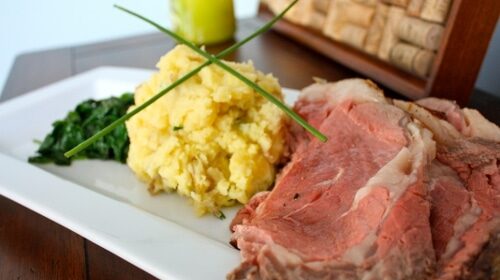 Awesome roast beef and mashed potatoes on a white plate.