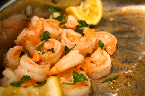 Sauteed shrimp lemon in pan appetizer for party.