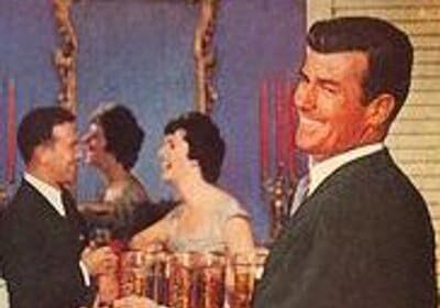 The ultimate host at an awesome holiday party, a picture of a man holding a tray of drinks.