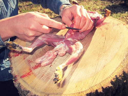 A man pinching the stomach.