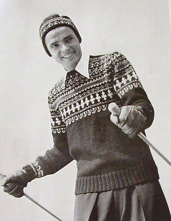 Vintage man wearing sweater and cap with ski poles.