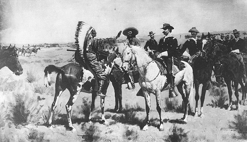 Vintage native American chief speaking to white men on horses.