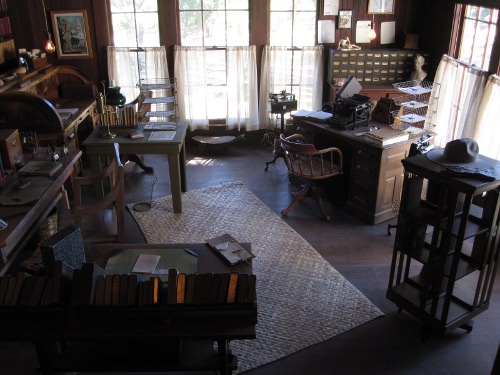 Vintage chairs, table and books placed at the floor illustration.