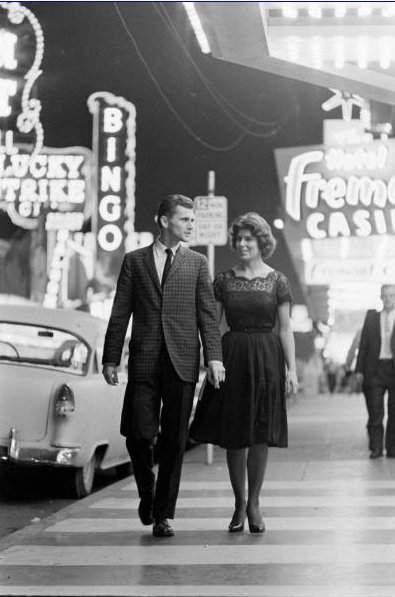 Vintage couple walking in downtown. 