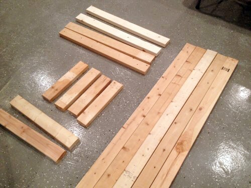 Cut piles of wood for homemade bench.