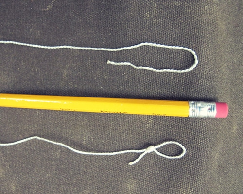 Knot the strip with pencil length.