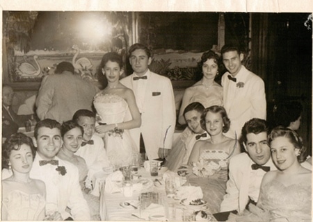 Vintage couples wearing white tuxedos. 