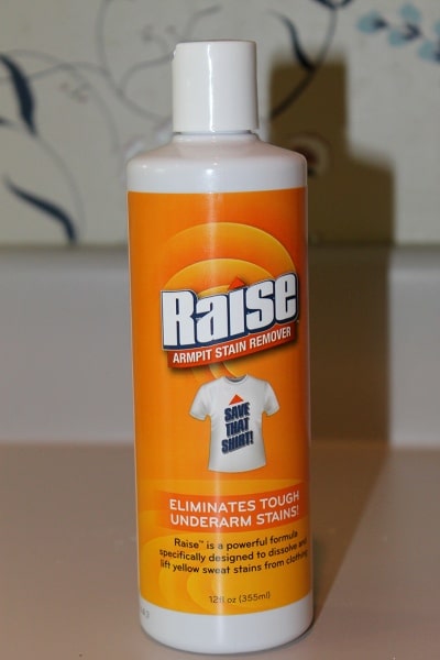 Raise armpit stain remover bottle.