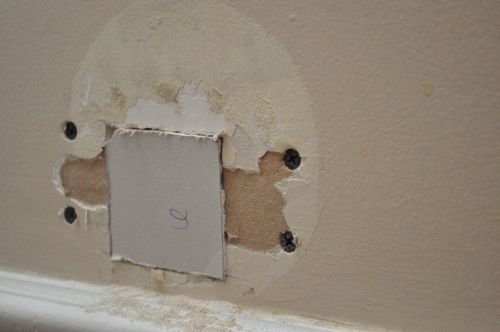 Cutting a square piece and fitted in drywall. 