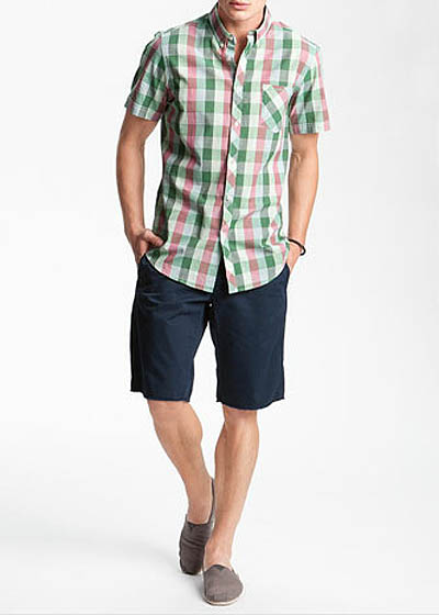 Man wearing shirt that go with shorts portrait.