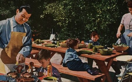 A family celebrating Memorial Day with a barbecue party, grilling delicious recipes.