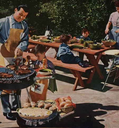 A family celebrating Memorial Day with a barbecue party, grilling delicious recipes.