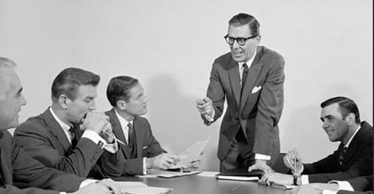 A SEO expert and a well-spoken manager are seated at the conference table.