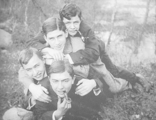 Vintage four young boys are laying black and white photo illustration.