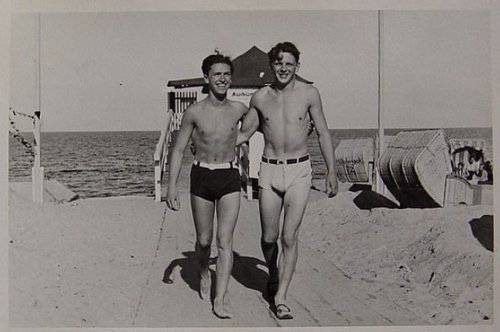 Vintage two young men are walking with less clothes and smiling black and white illustration.