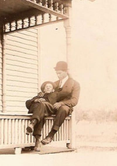 Vintage men with little boy sitting black and white photo illustration.