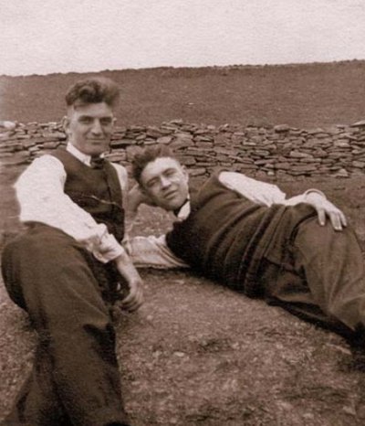 Vintage young boys are laying front of stones wall, black and white photo illustration.