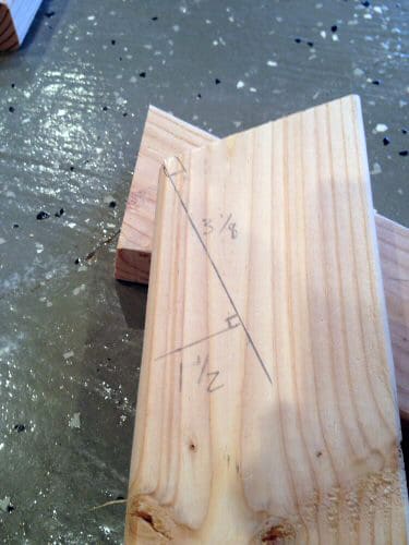 DIY homemade wooden sawhorse measurements on wood.