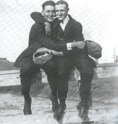 Vintage two men sitting and hugging each other black and white illustration.