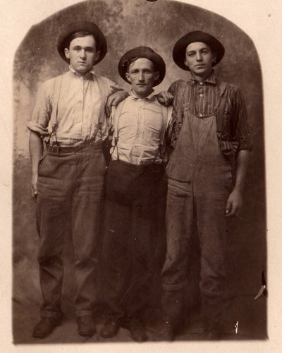 Vintage three young men standing and wearing hats black and white illustration.