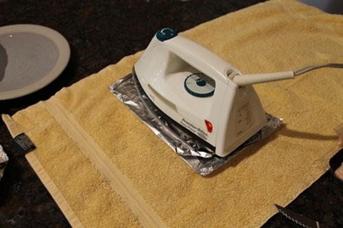 Vintage iron packet on a towel and placed iron on top.