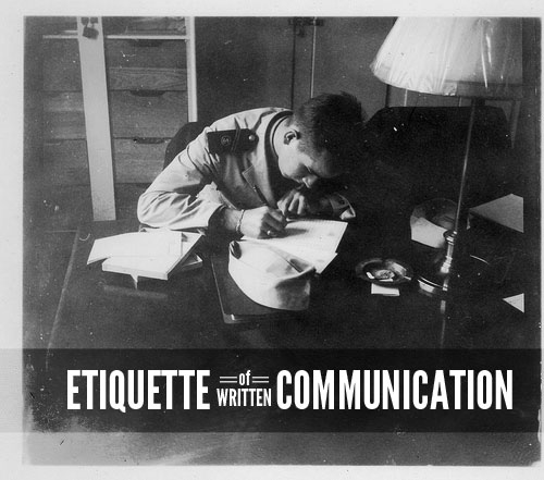 Young sailor at desk writing letter etiquette communication.