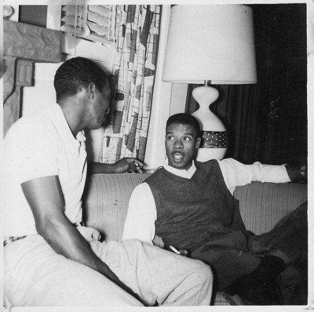 Vintage african american black men having conversation on couch.