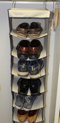 Shoe organizer hanger in closet.