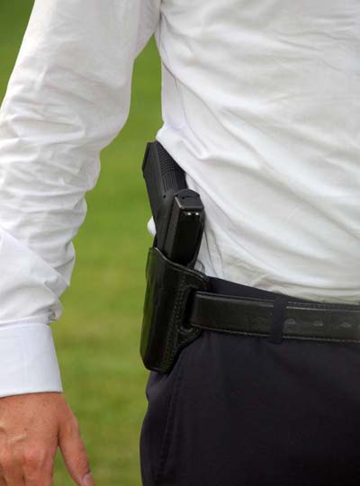 Paddle holster hip carry outside the waistband handgun.
