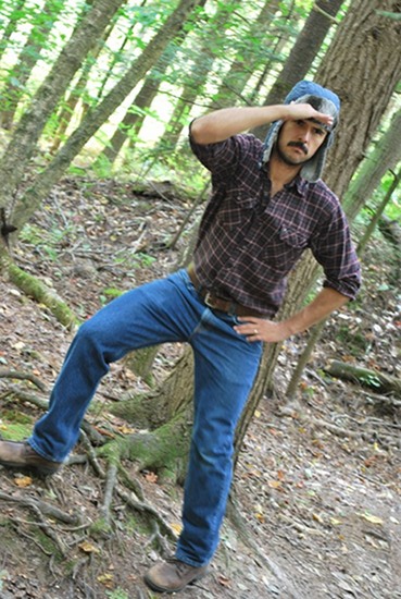 Vintage man standing in forest and looking his front.