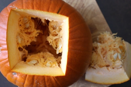 Pumpkin with square cut out to get seeds. 