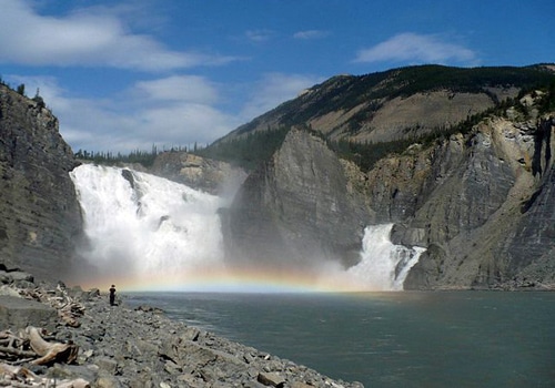 Virginia falls Nahanni river rainbow on water.