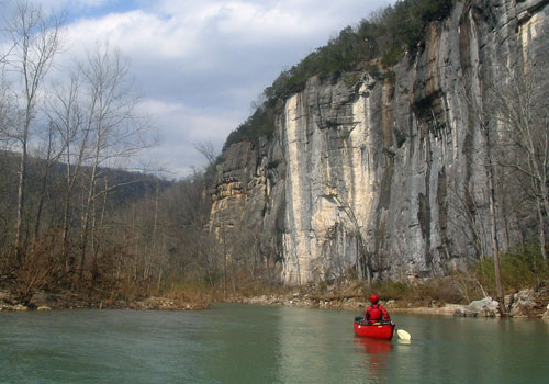 Cliffs along Buffalo national river canoe in front. 