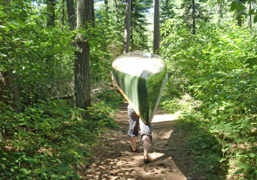 Bwca portage with canoe carrying over head.