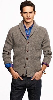 Man model wearing grey blazer with blue shirt and black pant.