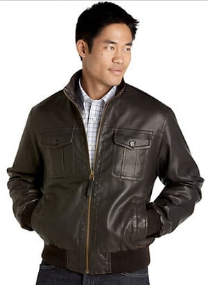 Young Asian man wearing leather jacket.