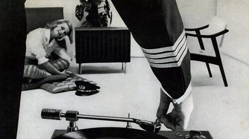 A black and white turntable advertisement.