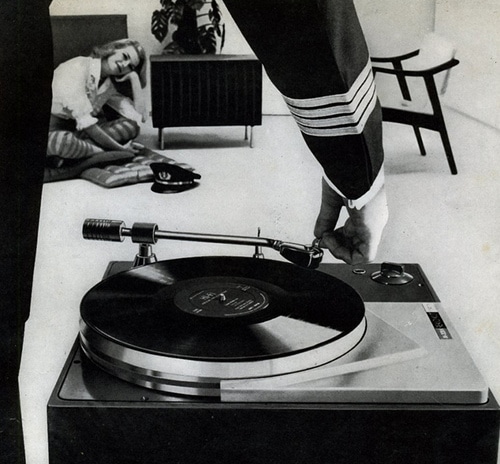 A black and white turntable advertisement.