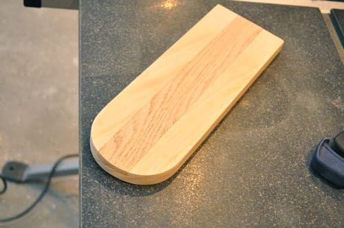 Rough cut for the curve and sanded both ends until the oak was completely flush with the pine top.