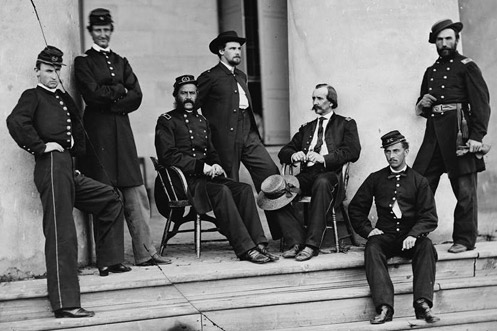 Union army civil war officers sitting and standing on stairs steps. 