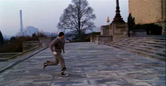 A man is doing a Stair Workout, running down a set of steps to burn off calories.