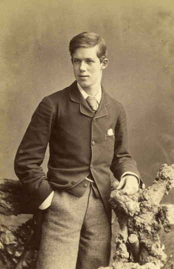 Vintage upper class young man portrait wearing trousers and vest.