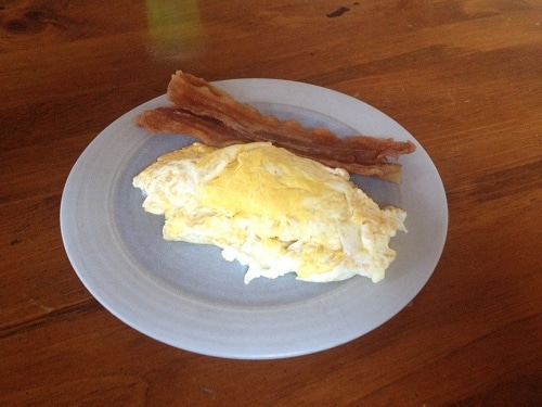 Eggs and bacon for breakfast in the plate to raise testosterone.