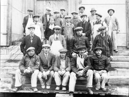 Vintage group of men wearing flat caps. 