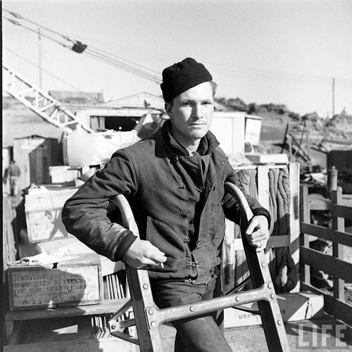 Vintage man wearing stocking watch cap in cold weather. 