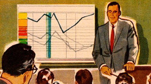 In his twenties, a man in a suit is giving a presentation on how to achieve lasting success by training your brain to a group of people.